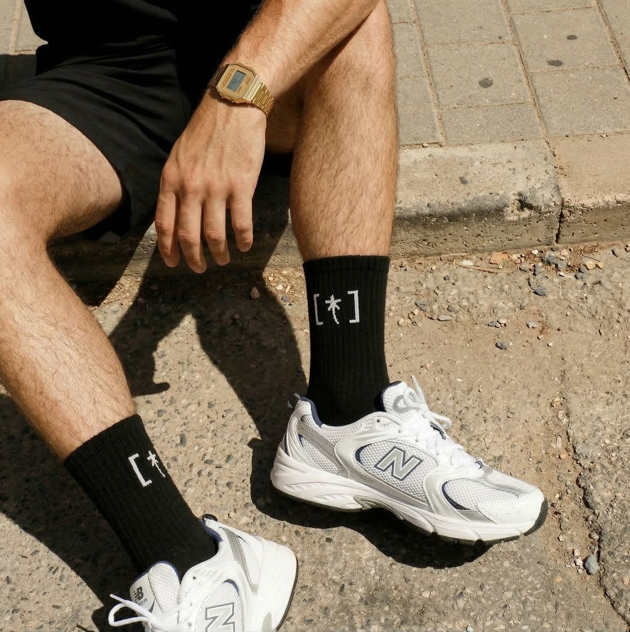 Close-up of black socks with the festival symbol