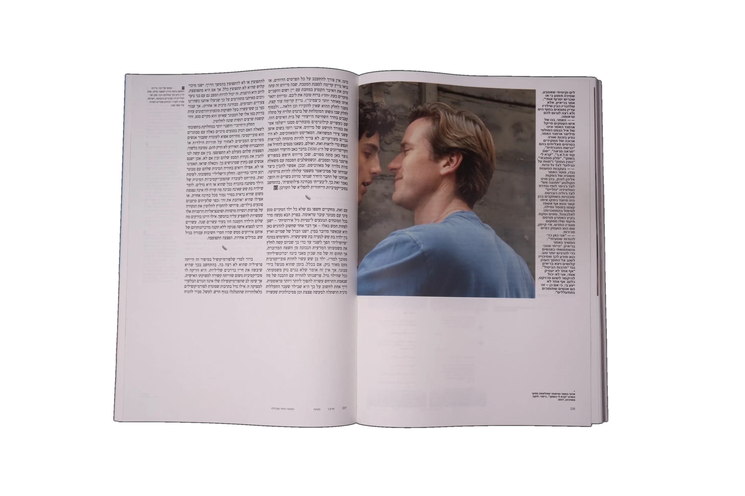 A spread with running text beside a large photograph of two men